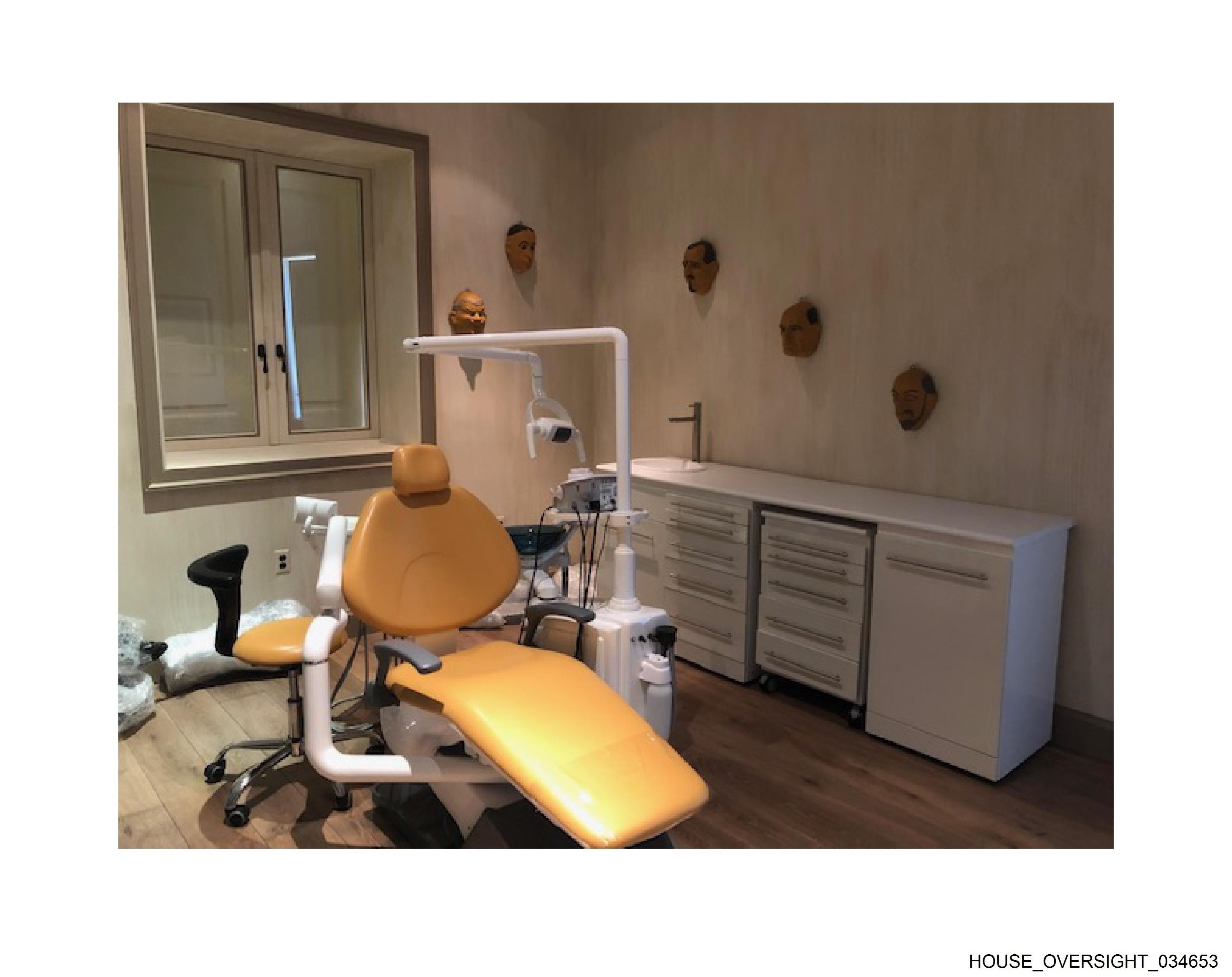Dental chair with masks on wall
